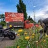 Indian FTR 1200 S parked at a coffee shop with an old pickup truck in Montana