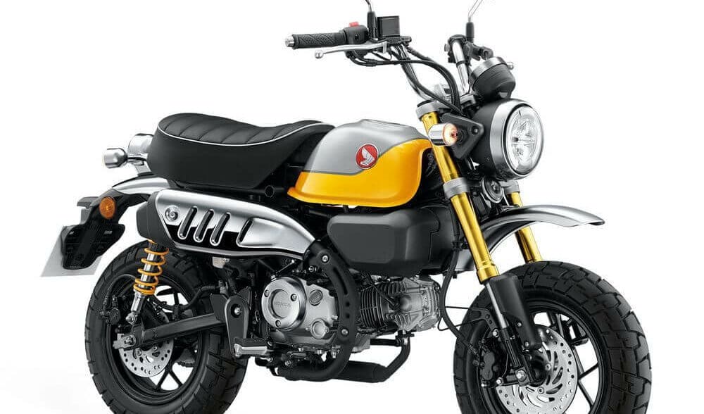 A side view of the 2022 Honda Monkey in Banana Yellow