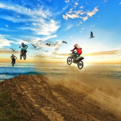 riders goingoff a dirt jump