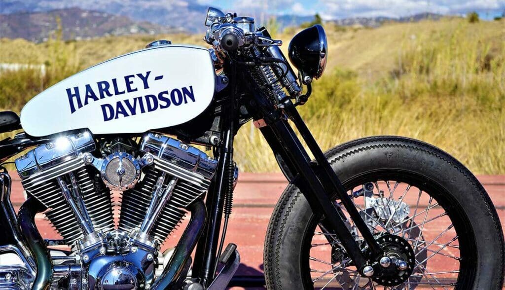 the front-side view from the custom "Springer Bobber Blue" Harley-Davidson Softail Standard Motorcycle from Lord Drake Kustoms