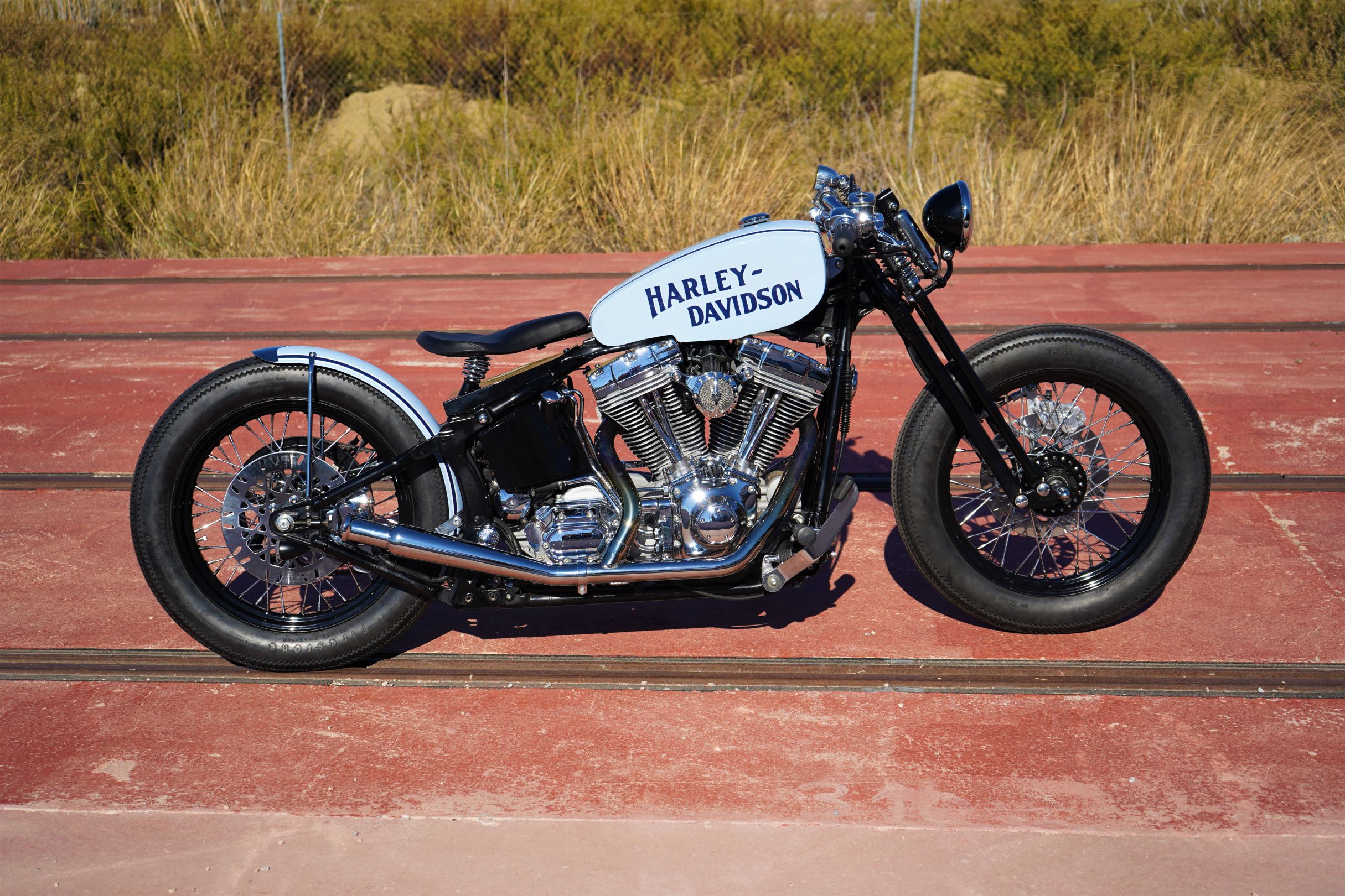 A side view from the custom "Springer Bobber Blue" Harley-Davidson Softail Standard Motorcycle from Lord Drake Kustoms