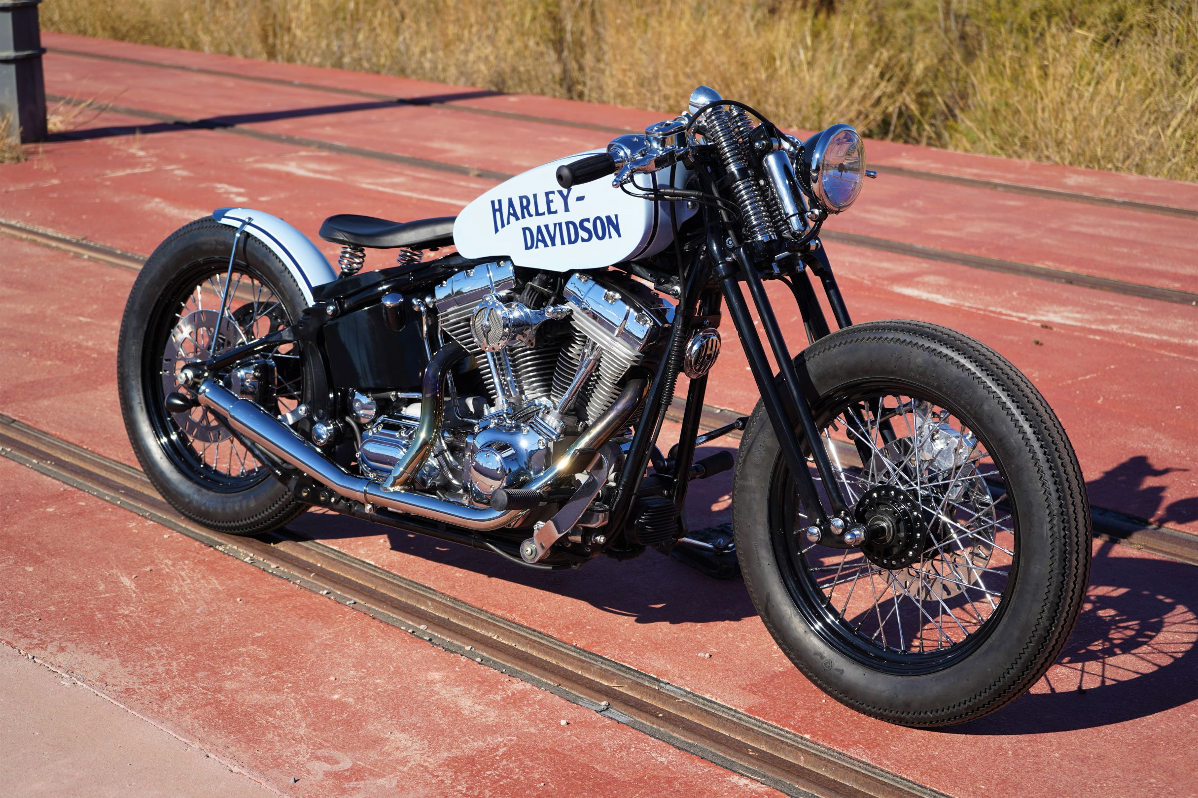 A side view from the custom "Springer Bobber Blue" Harley-Davidson Softail Standard Motorcycle from Lord Drake Kustoms