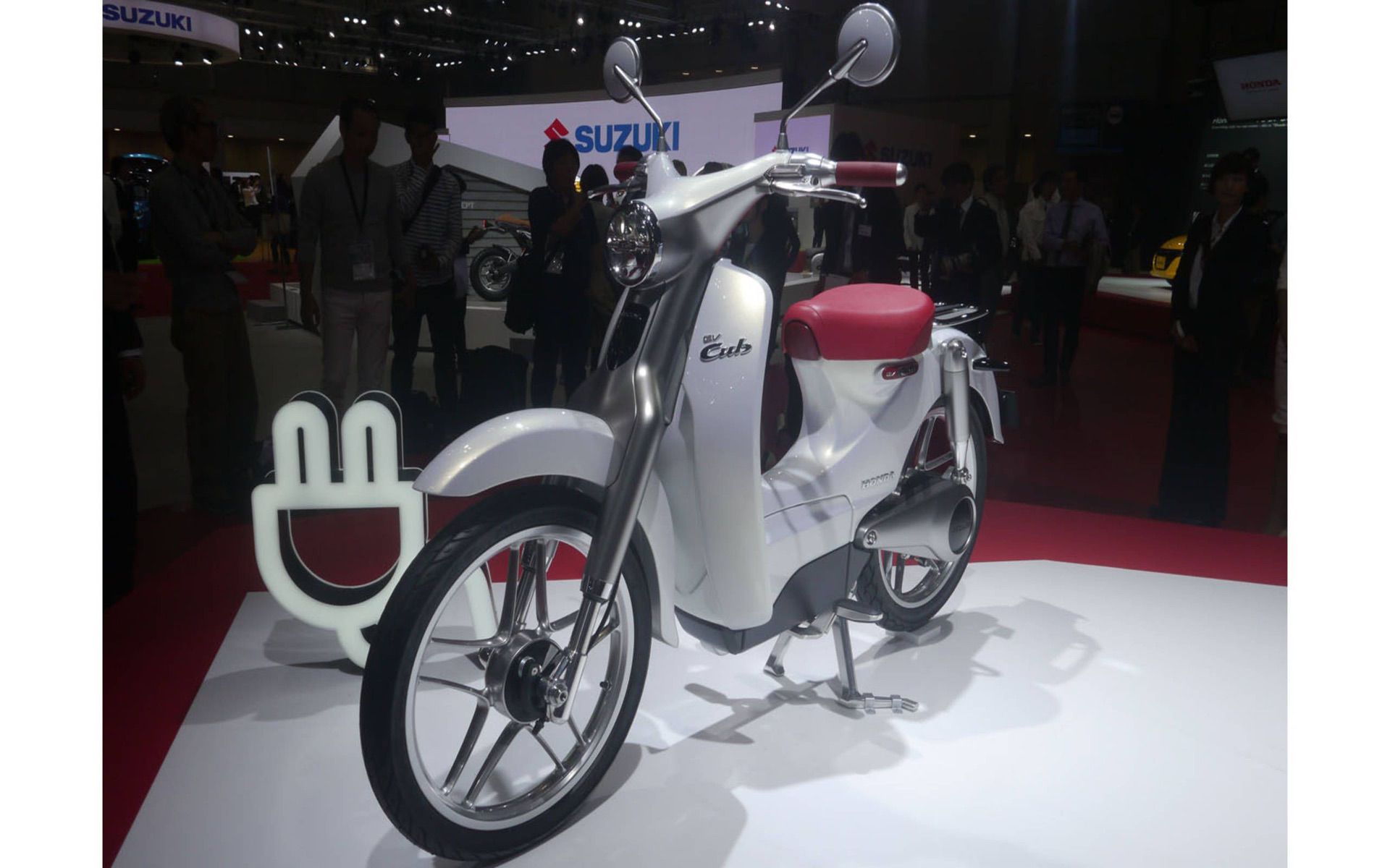 The Honda EV Cub concept vehicle. The swappable battery compartment is beside the left side footpeg