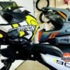 A Scorpion and Klim helmet with a Cardo Freecom 4X and Packtalk Edge installed on them.