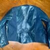 A flat rear view of the REV’IT! Coral jacket.