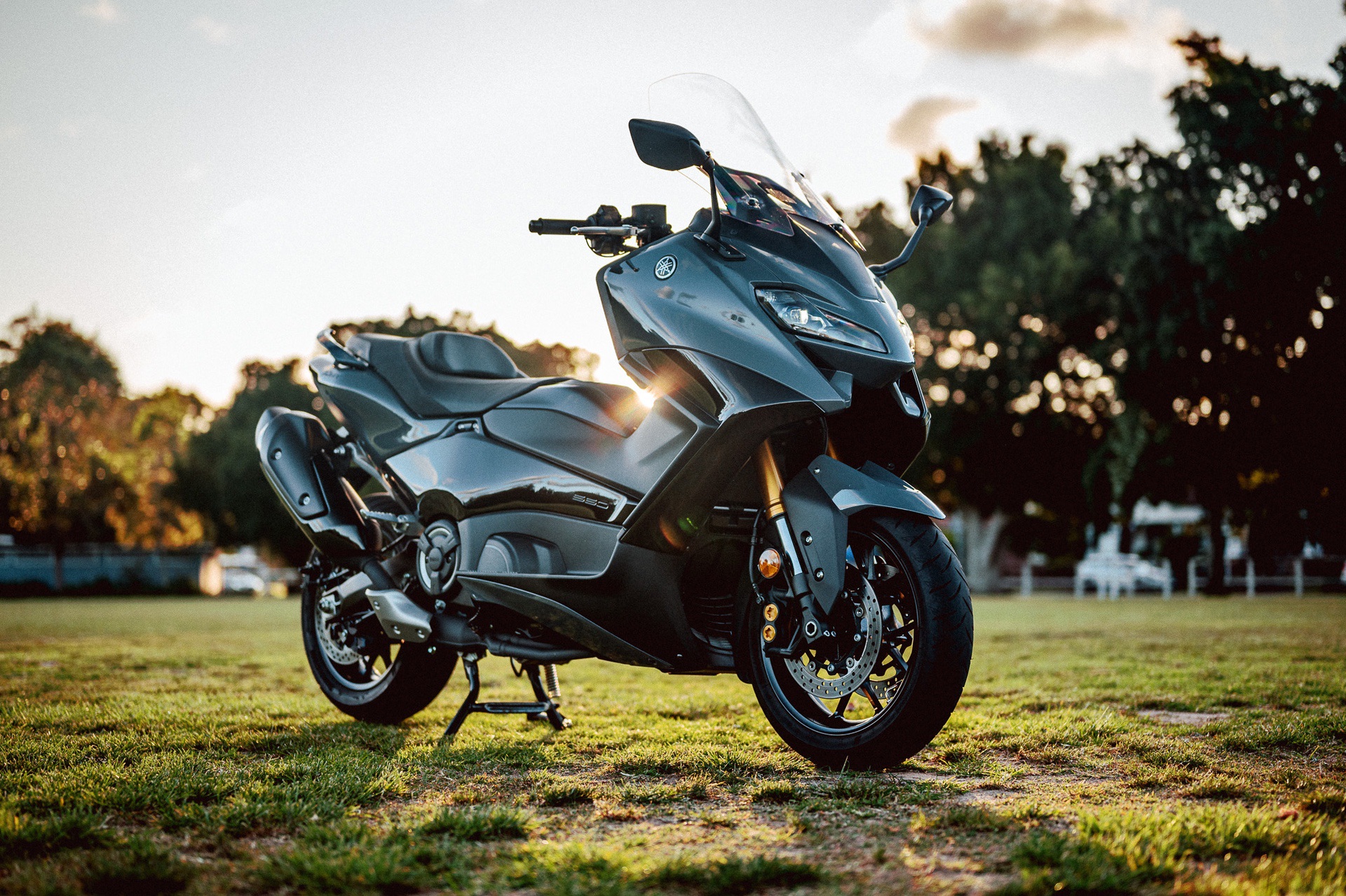 A 2022 Yamaha TMAX Tech MAX Scooter outside at sunset