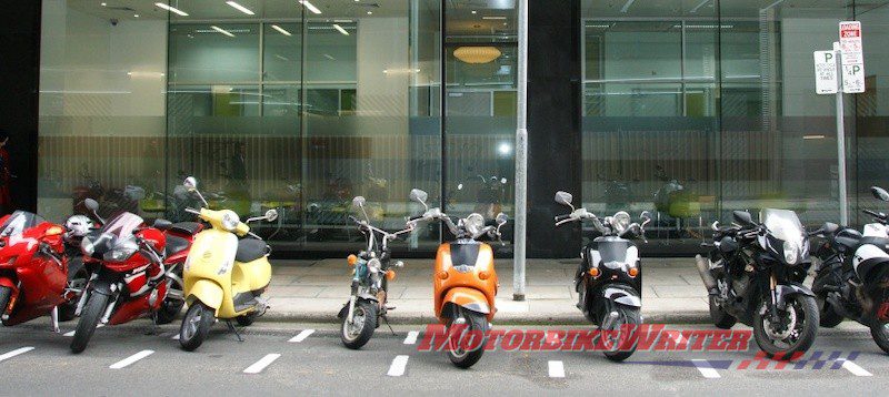 Rude riders squeezing between bikes