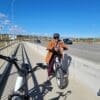 Rider smiling on the Kommoda on top of a bridge