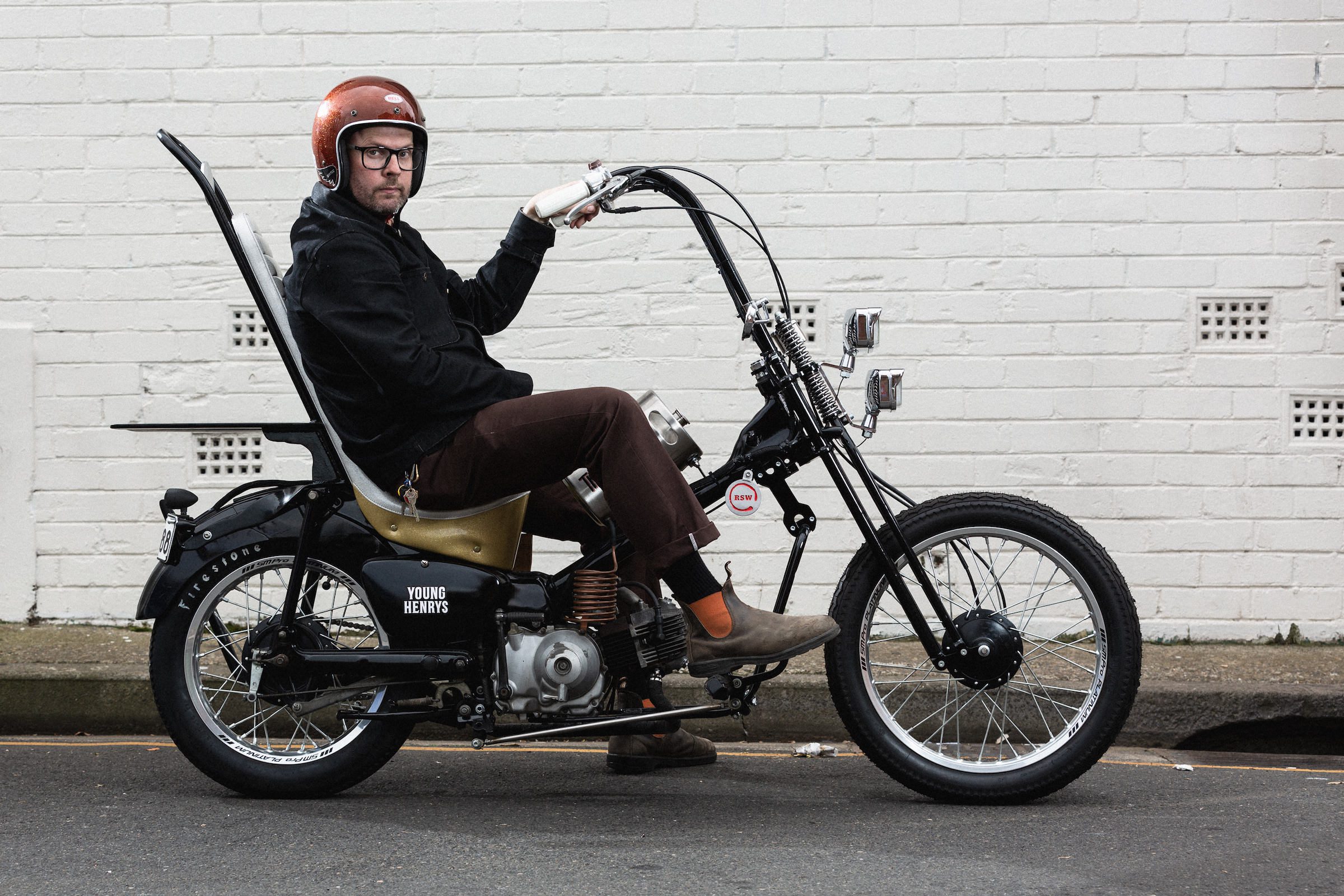 A custom chopper Honda CT110 'Postie' bike in a Sydney street