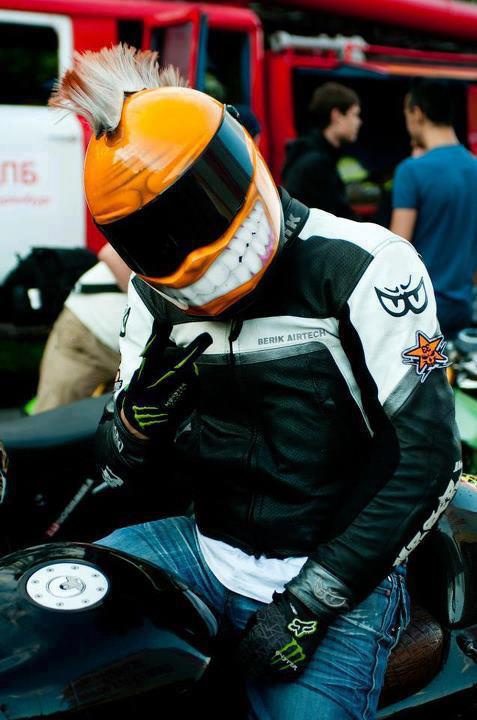 yellow smiley helmet with piece sign fingers
