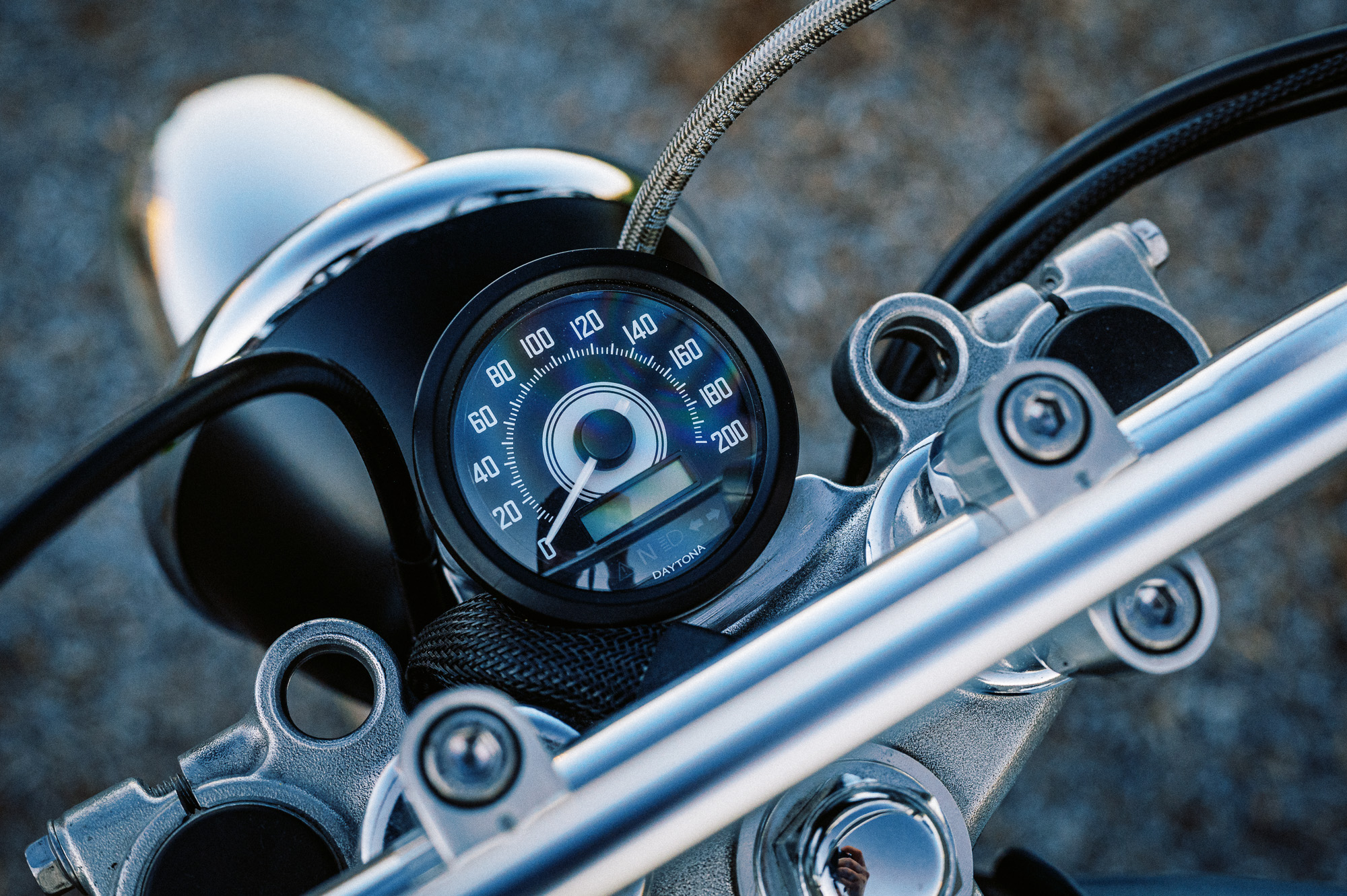 a custom Yamaha SR400 Motorcycle in Sydney at dusk in a vacant lot