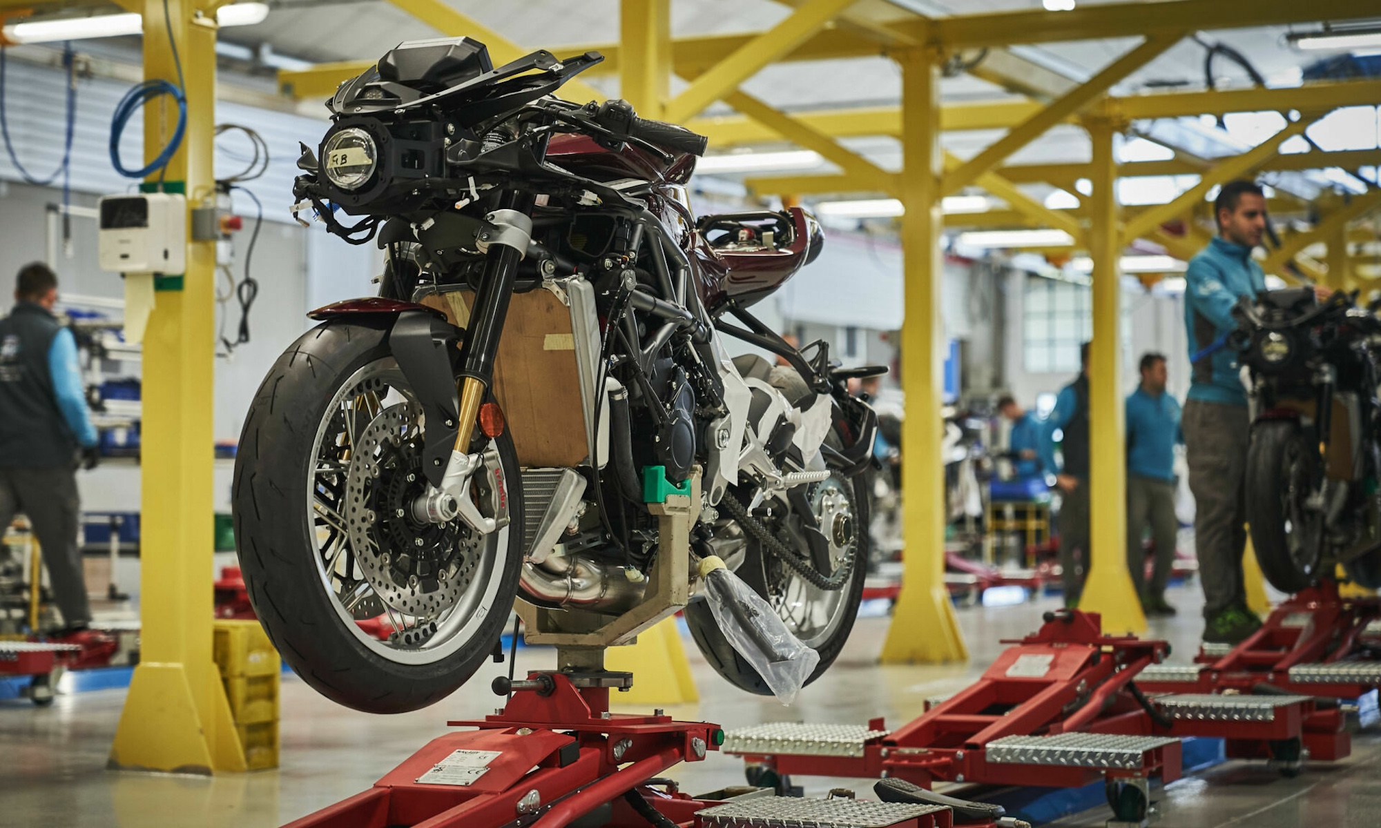 A view of a motorcycle production line in a factory.