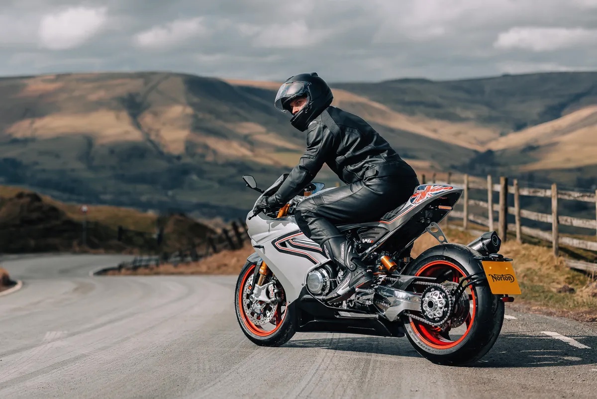 A man on a Norton motorcycle.