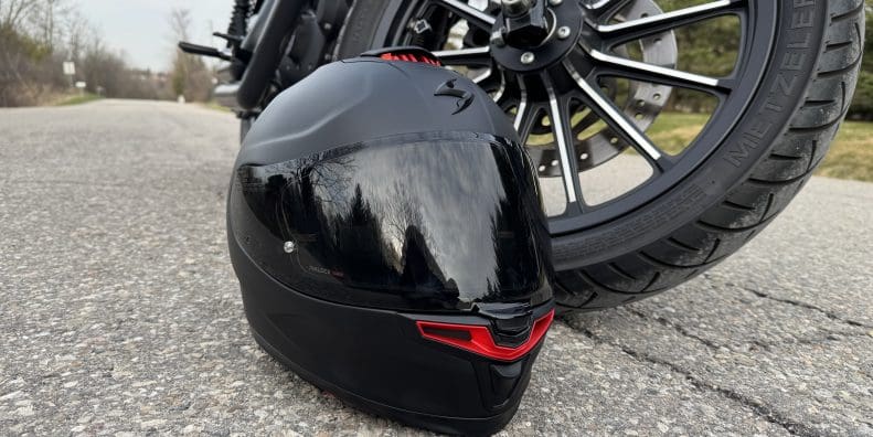 Scorpion EXO-Eclipse resting next to a motorcycle tire